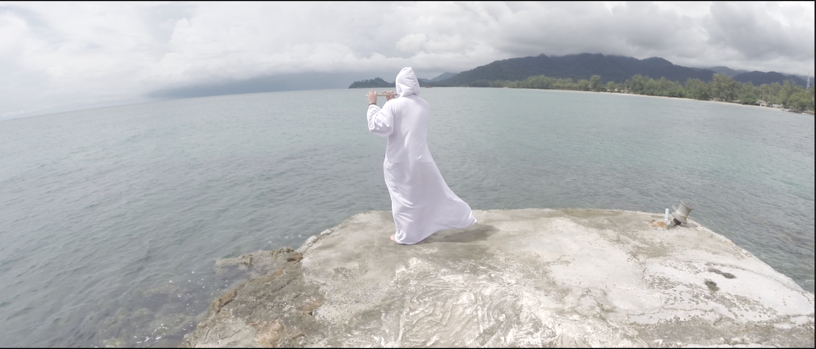 Wide aerial camera frame over a tropical bay