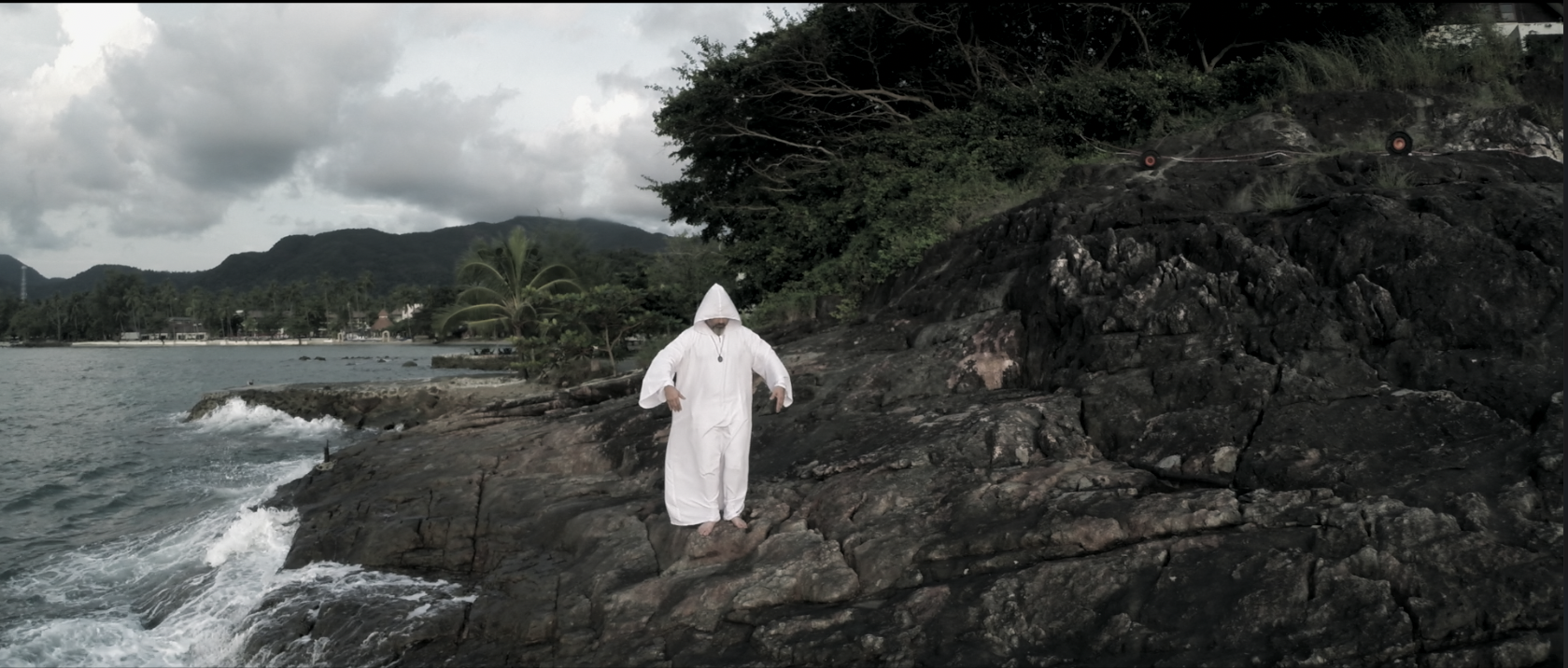 Aerial camera frame over a rocky tropical coastline